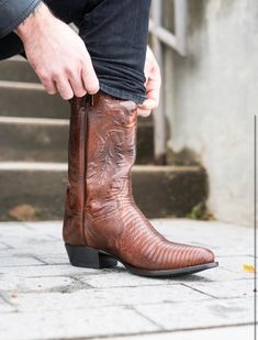 If you’re looking for an exotic lizard boot with classic western style, you found your match with the Winston. Made with a premium leather shaft and a Soft Strike Removable Orthotic for added comfort. Lizard 13" Height 13" Circumference Leather Lining Removable Antibacterial & Antifungal Soft Strike Orthotic Round Toe Leather Outsole Cowboy Heel Heel Height: 1 1/4" ***PREORDER DATES are subject to change, as these are "made to order" shoes. If you choose to cancel your PREORDER you will receive Custom Cowboy Boots, Boots Outfit Men, Dan Post Boots, Dan Post, Roper Boots, Find Your Match, Mens Cowboy, Harness Boots, Boots Outfit