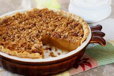 sweet potato pie with a pecan - crunch crust in a brown bowl on a table