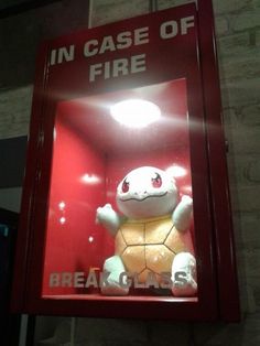 a sign that says in case of fire with an image of a stuffed animal inside