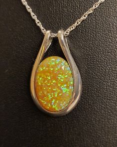 Sunny Yellow-Orange Opal Necklace, 13x18mm Lab Created Opal, See Video For Yellow, Green And Touch Of Lavender Fire! Sleek 925 Sterling Silver Pendant Rhodium Plated 18" Sterling Silver Chain. Chain Length Options Available By Messaging Seller At Time Of Purchase. Gift Box Included. Sterling Silver Orange Cabochon Jewelry, Orange Cabochon Sterling Silver Jewelry, Formal Orange Sterling Silver Necklace, Formal Orange Cabochon Necklace, Silver Oval Necklace With High Luster, Orange Round Pendant Jewelry For Formal Occasions, Orange Oval Sterling Silver Jewelry, Yellow Oval Sterling Silver Necklace, Orange Sterling Silver Jewelry For Anniversary