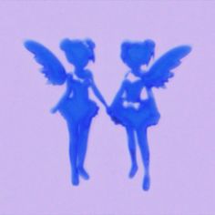 two blue angels flying in the sky with their wings spread out and facing each other