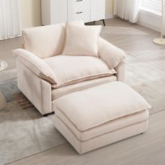 a chair and ottoman in a living room with white carpeted flooring on the side