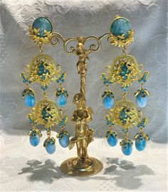 "Vibrant Filigree Gold Plated, Turquoise Glass Cabochon & Blue Rhinestones Long Clip on Earrings Excellent condition, measures 4.75\" long We combine shipping Pictures are part of the description, please look at all the pictures and if you have any question feel to ask! Make sure you check out my other vintage items!" Turquoise Gemstone Earrings For Party, Bohemian Blue Jeweled Earrings, Turquoise Costume Jewelry Earrings For Gift, Blue Jeweled Dangle Jewelry, Blue Jeweled Drop Earrings, Blue Jeweled Teardrop Earrings, Blue Costume Jewelry Wedding Earrings, Turquoise Gemstone Party Jewelry, Blue Costume Jewelry Earrings For Wedding