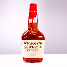 a bottle of maker's mark whisky sitting on a table