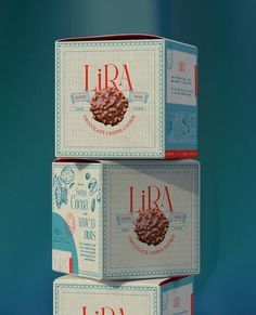 three boxes of lira chocolate cookies stacked on top of each other in front of a blue background