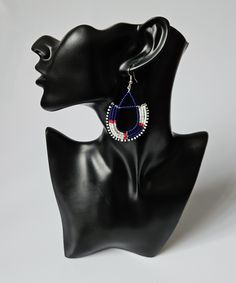 Our stylish maasai earrings will make you stand out from the rest. Made with love and care. The earrings are 100% handmade using original fine beads. Color: Navy blue, red, white & black. Size: 2.5" long, 1.5" wide. ^^These earrings ships through dhl express.  More earrings; https://www.etsy.com/shop/TribalTess?ref=seller-platform-mcnav§ion_id=21293980 Buy multiple items and pay shipping for ONE item ONLY. Blue Hoop Earrings For Gift, Colorful Beads Small Hoop Jewelry For Gift, Colorful Beads Small Hoop Earrings As A Gift, Traditional Hoop Jewelry With Colorful Beads, Unique Blue Earrings, Colorful Beads Small Hoop Earrings For Gift, Traditional Blue Hoop Earrings For Gift, Blue Dangle Hoop Earrings As Gift, Hoop Earrings With Dangling Round Beads As Gift