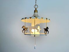 a carousel light with horses on it