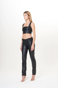 Low-waisted genuine nappa leather pants with belt loops. Slim fit designed to make the most of the figure.Exterior: 100% Italian lambskin.Interior: 100% Italian viscose.Made in Italy.Clean in leather specialized laundries.Runs true to sizeSize 36: hips 88cm, height, 77 cm, waist 72 cmSize 38: hips 92 cm, height 78 cm, waist 76 cmSize 40: hips 96 cm, height 79 cm, waist 80 cmSize 42: hips 100 cm, height 80 cm, waist 84 cmSize 44: hips 104 cm, height 81 cm, waist 88 cm Luxury High-waisted Faux Leather Pants, Luxury Sleek Full-length Leather Pants, Luxury Faux Leather Full-length Pants, Stretch Full-length Black Leather Pants, Fitted Full-length Leather Pants With Zipper Closure, Low Waisted, Nappa Leather, Leather Pants, Genuine Leather