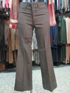 "Original 60s deadstock flared pants. NOS 60s trousers. Mods style. Made in Italy. They feature a jean model, such as the brown woollen cloth fabric whose weft threads are placed diagonally (see pic.9). Low waist with belt loops and besom pockets (pics 1-3). No back pockets (pic.5). Front zipper and button. Mint conditions. They fit size S, about 28 US Measurements: (lay flat and double waist, hips and thigh)) pls. consider the rise in order to calculate the waistline Waist 28.3\" rise 9.05\" hi Retro Wide Leg Pants For Fall, Retro Wide Leg Pants For Work In Fall, Tailored Brown Pants For Winter, Fitted Brown Dress Pants For Fall, Brown Fitted Dress Pants For Fall, Vintage Wide Leg Pants For Fall, Retro Winter Trousers, Retro Fitted Wide Leg Pants For Fall, Vintage Wide Leg Pants For Winter