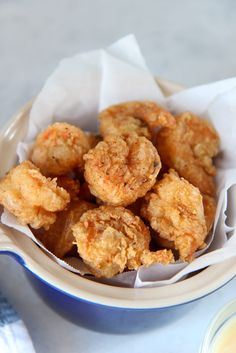 some fried food in a bowl on a table