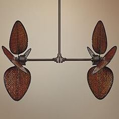 a ceiling light with four leaf shaped lights hanging from it's center point,