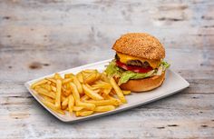 a hamburger and french fries on a plate