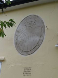 the sundial on the side of a building