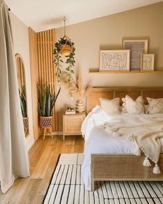 a bed sitting in a bedroom next to a wooden shelf filled with potted plants