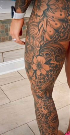 a person with tattoos on their legs