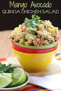 a yellow bowl filled with rice salad next to a lime wedge on top of a table