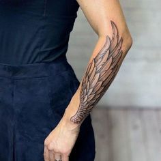 a woman with a tattoo on her arm