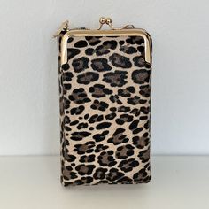 a leopard print purse sitting on top of a table