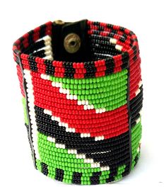 Zulu Bead, Kenya Jewelry, Masai Bracelet, Africa Bracelet, Bead Cuff Bracelet, Statement Bracelet, Masai Jewelry, Africa Jewelry, Wrap Bracelet. FREE SHIPPING FOR ALL ADDITIONAL JEWELRY IN YOUR CART You will receive it Exactly as pictured in the Kenyan colors. USA #1. Order Total of $35 eligible for $0 shipping #2. Order Total of $60 eligible for Free Expedited shipping via DHL Express. EUROPE #1. Order Total of $60 eligible for Free Expedited shipping via DHL Express.. Still shopping? Checkout Bohemian Cuff Bracelet With Large Beads, Bohemian Adjustable Cuff Bracelet With Large Beads, Adjustable Bohemian Cuff Bracelet With Large Beads, Adjustable Bangle Beaded Bracelets For Festivals, Adjustable Bangle With Round Beads For Festivals, Festival Bangle Bracelet With Beads, Red Bohemian Bracelet With Black Beads, Traditional Adjustable Bangle With Colorful Beads, Beaded Bangle Bracelet For Festivals