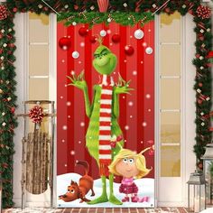 the grinch door cover is decorated with christmas decorations