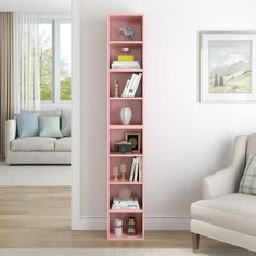 a living room with a white couch and pink book shelf