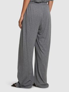 Elastic waistband with drawstring. Two side pockets. Model is wearing a sizeS Elastic Waistband Wide Leg Pants For Daywear, Drawstring Wide-leg Loungewear Bottoms, Drawstring Wide-leg Loungewear Pants, Full Length Lounge Pants With Drawstring, Lounging Drawstring Wide-leg Pants, Full-length Drawstring Lounging Pants, Full Length Drawstring Pants For Lounging, Wide-leg Drawstring Pants For Lounging, Full-length Harem Pants With Elastic Waistband For Loungewear