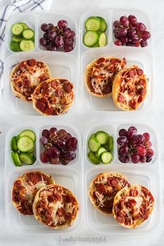 six plastic trays filled with different types of food on top of a white table