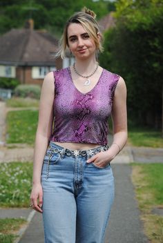 ♥Fabulous 90s/Y2K purple snake print crop top with mirrored sequins all over! ♥Brand: Ekshe ♥Would best fit UK size 6, has some stretch to it. ♥Pit to pit measurement: 15 inches ♥In fair vintage condition, there are a couple of missing sequins and some faint stains that are difficult to notice unless you turn the top inside out. This is reflected in the price. ♥Model is size 8-10 and 5'7, the top is a little tight on her Purple Snake, Cropped Tops, Cropped Tube Top, Vintage Purple, Print Crop Tops, Disco Ball, Snake Print, Y2k Vintage, Tube Top