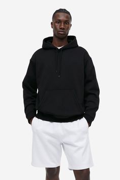 Loose-fit sweatshirt hoodie in medium weight cotton-blend fabric with a generous  but not oversized silhouette. Jersey-lined  drawstring hood  dropped shoulders  long sleeves  and a kangaroo pocket. Wide ribbing at cuffs and hem. Soft  brushed inside. Relaxed Fit Hoodie With Drawstring For Loungewear, Black Relaxed Fit Hoodie With Drawstring Hood, Oversized Hoodie With Drawstring And Crew Neck, H&m Long Sleeve Sweatshirt With Ribbed Cuffs, H&m Winter Sweatshirt With Ribbed Cuffs, Relaxed Fit Solid Sweatshirt With Kangaroo Pocket, Black French Terry Hooded Hoodie, Fleece Hooded Sweatshirt With Drawstring, H&m Fall Sweatshirt With Ribbed Cuffs