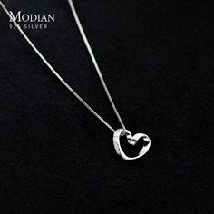 Heart Pendant Necklace for Women Elevate your style with this exquisite 925 sterling silver heart pendant necklace. Designed for elegance, it features a simple, yet captivating, line heart pendant that adds a touch of romance to any outfit. Crafted with precision and plated in platinum, this necklace exudes sophistication and luxury. The fine jewelry piece is perfect for special occasions like weddings or as a thoughtful gift to celebrate a cherished moment. SPECIFICATIONS Item Weight: - Certifi Elegant White Gold Heart Charm Necklace, Elegant Sterling Silver Heart Pendant Necklace, Minimalist Sterling Silver Heart Necklace With Round Pendant, Silver Minimalist Heart Necklace With Clavicle Chain, Elegant Sterling Silver Heart Necklace As Gift For Her, Dainty Silver Heart Necklace For Formal Occasions, Silver Minimalist Necklace For Valentine's Day, Elegant White Gold Heart Necklace As Gift For Her, Elegant White Gold Heart Pendant Necklace