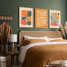 a bedroom with two paintings on the wall above the bed, and a wicker headboard