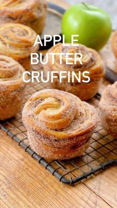 apple butter crufffins on a cooling rack with an apple in the background