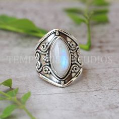 Indulge in timeless elegance with our handmade Rainbow Moonstone Ring for women, crafted meticulously in lustrous sterling silver. This enchanting piece features a high-quality, ethereal Rainbow Moonstone that captures the essence of a colorful, iridescent rainbow within its depths. The exquisite craftsmanship and delicate design make it a perfect accessory for any occasion, adding a touch of sophistication and mystique to your ensemble. Elevate your style with this stunning and unique creation. Engagement Ring Marquise, Ring Marquise, Rainbow Moonstone Ring, Delicate Design, Alternative Engagement Rings, Chic Jewelry, Moonstone Ring, Ring Ring, Ring For Women