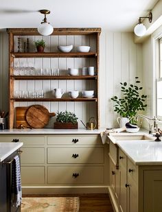 the instagram page shows an image of a kitchen with wooden cabinets and open shelving