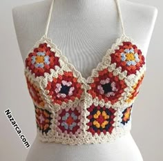 a crocheted bralet on a mannequin torso