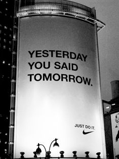 a sign that says, yesterday you said tomorrow just do it on the side of a building