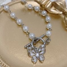 Brand New, Silver Alloy, Creamy Faux Pearl And Rhinestone Crystal Butterfly Pendant Choker Necklace. Length: 16" Total Length. White Rhinestone Clavicle Chain Necklace For Party, White Rhinestone Clavicle Necklace For Party, White Rhinestone Necklace With Pearl Chain For Gift, Gift White Rhinestone Necklace With Pearl Chain, White Pearl Rhinestone Necklace With Clavicle Chain, White Rhinestone Crystal Clavicle Necklace, Adjustable White Rhinestone Necklace, White Crystal Rhinestone Clavicle Necklace, Coquette Diy