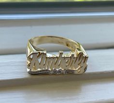 Medium Size Personalized Name Ring In Real 10K & 14K Gold *FLAT FACE * MADE IN USA (HAND MADE ITEM) Make the names of your family, friends and love ones into rings for their gift. It's great as an everyday necklace and makes an awesome gift! This Item is 100% customization especially for you. Item Description *Material: Real Gold *Type: *FLAT FACE* ( Like photo) with Heart Tail with Bit Work *Ring size: ring sizes between 1-11 (including half sizes) *Size of Ring : 20mm*8mm *Script Design *O Classic Gold Engraved Ring With Custom Name, 14k Gold Engraved Ring For Promise With Names, Classic 14k Gold Engraved Ring With Custom Name, 14k Gold Promise Ring With Names, 14k Gold Nameplate Ring For Anniversary, Custom Gold Engraved Personalized Ring, Classic Custom Name Rings For Anniversary, Classic Engraved Ring With Names For Anniversary, Yellow Gold Engraved Promise Ring With Name