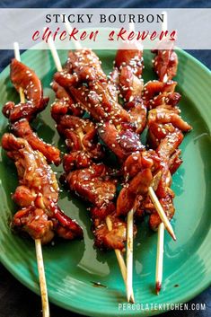 sticky bourbon chicken skewers on a green plate