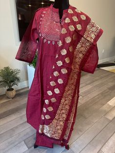 Just looks like a wow!! This premium, Chanderi mixed silk salwar suit set consists of a kurti top with mirror work on the neck yoke and an open Chinese collar, a straight pant with elastic band and a zari work banarasi dupatta. Shade of the set is a deep oil red and perfect in time for Valentines day :) Size: Fits bust sizes 45-46 inches (size 3XL) Size 3XL | Super gorgeous mirror work salwar suit set with banarasi dupatta | Chanderi silk suits online shopping usa | Indian kurti set | plus sized Unstitched Slub Silk Suit With Mirror Work, Anarkali Unstitched Suit With Mirror Work In Slub Silk, Slub Silk Anarkali Set With Mirror Work, Slub Silk Palazzo Set With Mirror Work For Festivals, Mirror Work Slub Silk Palazzo Set For Festivals, Bollywood Style Slub Silk Palazzo Set With Mirror Work, Slub Silk Palazzo Set With Mirror Work, Unstitched Slub Silk Suit With Gota Work, Semi-stitched Slub Silk Salwar Kameez With Mirror Work