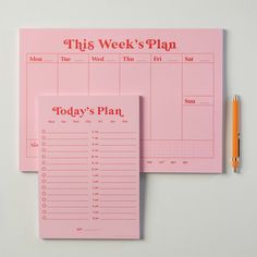 this week's plan is shown on top of a pink notebook with a pen next to it