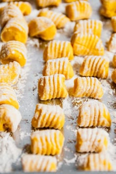 several pastries are lined up on a baking sheet