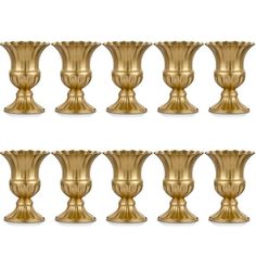 six golden vases are lined up against each other