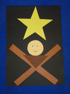 a child's artwork with a star and two crossed sticks in front of it