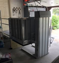 the inside of a garage with an open door