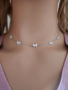 925 Sterling Silver Cubic Zirconia Butterfly Choker Necklace Real 925 Sterling Silver NOT SILVER PLATED High Quality Silver Pendant  High polished rhodium finish gives this pendant a stunning shiny look that lasts many years. We have hundreds Silver Jewelry in stock. If you don't see what you are looking , feel free to ask us. Trendy, dainty, luxurious, classic with modern touch, elegant and fancy, fine quality made  925 Sterling Silver cubic zirconia butterfly choker necklace. Descriptions 925 Sterling Silver Cubic Zirconia Choker Necklace Metal Type: 925 Sterling Silver ( Not Plated) Width & Length: 6.5mmx7.5mm.  Setting Type: Pave Set  Finishing : High Polish Rhodium Plate Pendant Length: 15 - 14 - 13 Inches Adjustable Shipping : 1 - 2 Days Can be personalized: Yes Free shipping With $3 White Sterling Silver Butterfly Necklace With Clavicle Chain, White Cubic Zirconia Butterfly Necklace Gift, Butterfly Necklace As A Gift, Round Butterfly Necklace Gift, Round Butterfly Necklace For Gift, Silver Butterfly Necklace With Adjustable Clavicle Chain, Adjustable Silver Butterfly Necklace With Clavicle Chain, Silver Stainless Steel Butterfly Necklace As Gift, White Gold Cubic Zirconia Butterfly Necklace As Gift