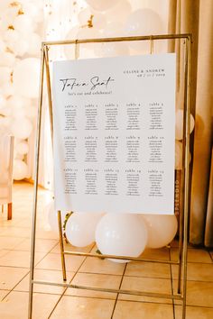 a table plan with white balloons in the background