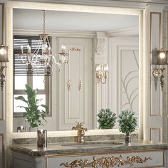 a bathroom vanity with a mirror, sink and chandelier