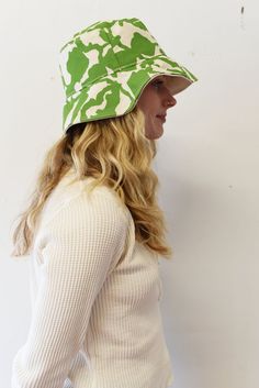 The perfect lightweight bucket hat for sunny spring and summer days! Now available in two sizes (Small/Medium & Large) since we had some issues with these not be consistent last season. Print: 1 color screen print Size: Small/Medium 21-22.5 inches, Large 22.5-23 inches (inside circumference) Material: Cotton, Cotton Canvas Lining Care: Hand Wash Cold. Hang or Lay Flat to Dry. Do not dry in the dryer. Adjustable Green Bucket Hat For Summer, Everyday Summer Bucket Hat With Curved Brim, Spring Everyday Bucket Hat With Uv Protection, Curved Brim Bucket Hat For Summer, Everyday Curved Brim Bucket Hat For Summer, Playful Cotton Bucket Hat With Short Brim, Casual Bucket Hat With Uv Protection For Spring, Lightweight Green Bucket Hat For Outdoor, Trendy Spring Bucket Hat With Uv Protection