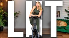 a woman is riding an exercise bike in front of the letters i, l, and j